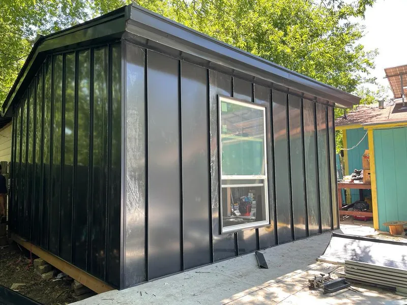 Black standing seam metal wall panels for Roof Inspection in Solana Beach