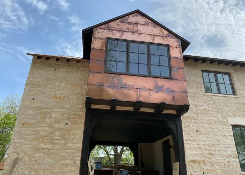 Copper metal panel facade on a stone building for Skylight Installation in Solana Beach
