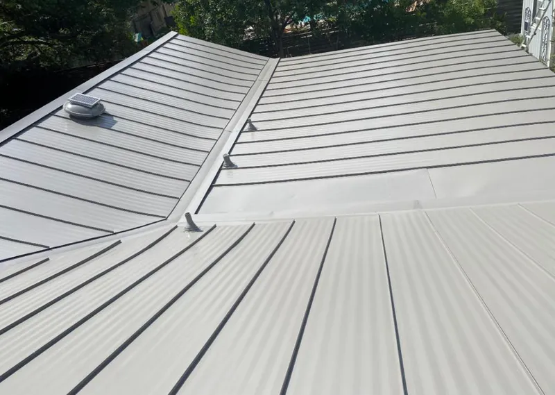 Solar attic fan installed on a metal roof for Roof Ventilation in Solana Beach